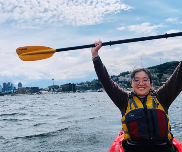 Yewei Huang smiling while kayaking